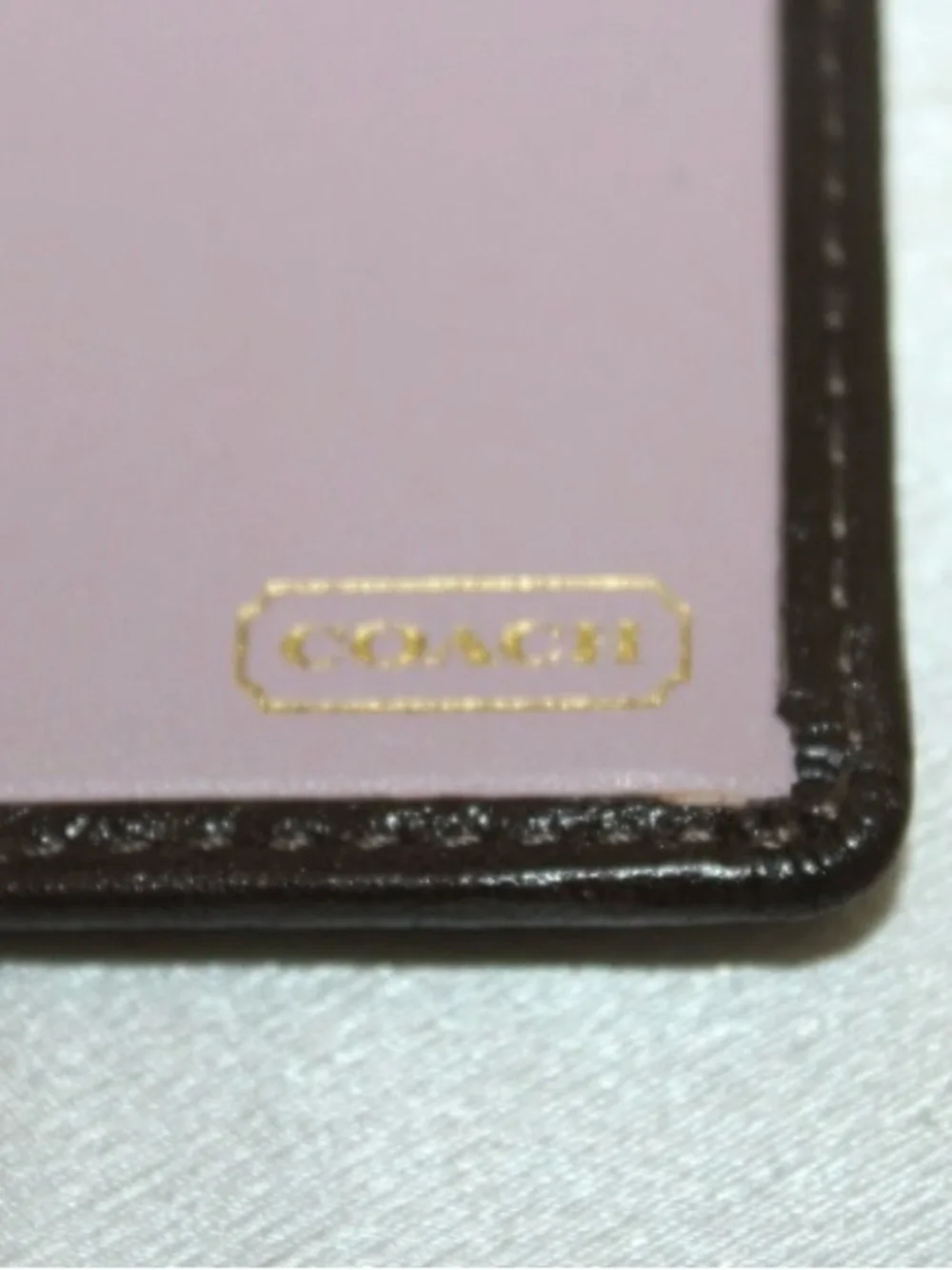 Coach checkbook cover—like